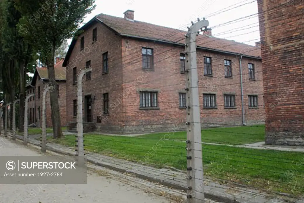 Prisoner barracks inside electrified fence at Auschwitz Death Camp Auschwitz Poland