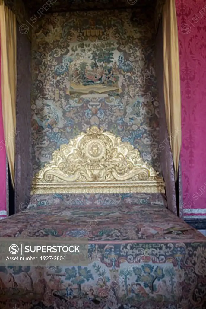 Ornate bed of Louis XIV showing the Sun King design Palace of Versailles Versailles France
