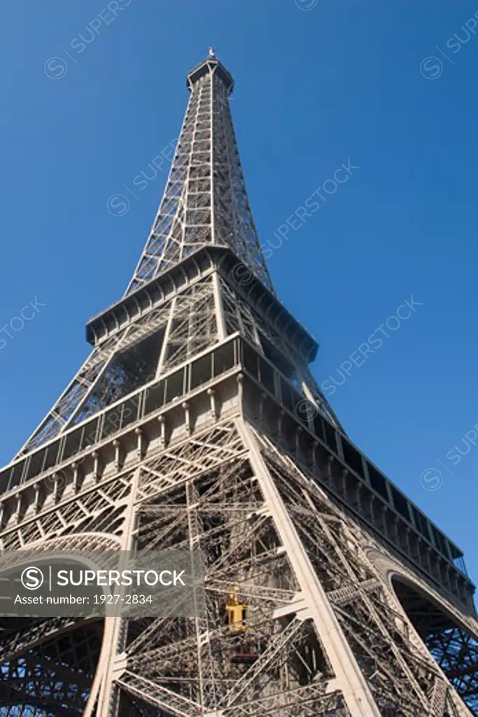 Elevator climbs the lower leg of Eiffel Tower Paris France