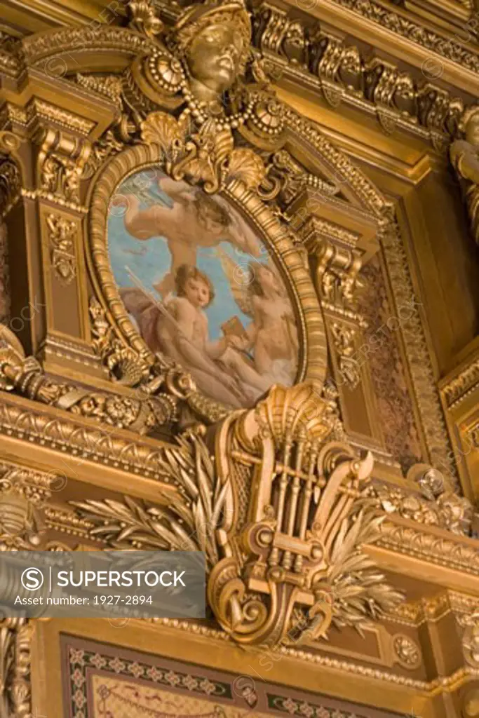 Ornate decoration including a styalized lyre decorate the capitals of the Grand Foyer in the Paris Opera House Paris France