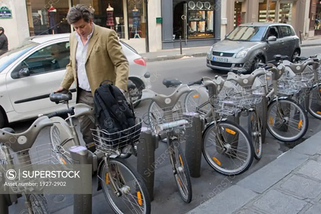 Renting one of over 20 000 bicycles in the Velib system providing clean and cheap transporation all over Paris Paris France