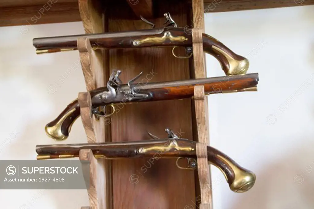 Flink-lock pistols on display in the Magazine used to store weapons and ammunition.Colonial Williamsburg,Virginia