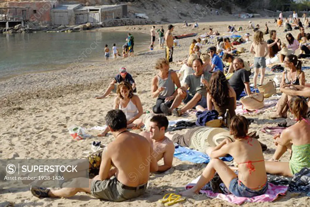 People enjoying sundays in popular Benirras beach  where drum players play until sunset  Ibiza  Spain