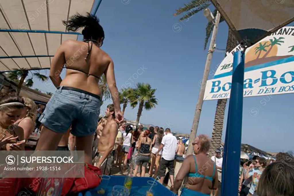 People of all ages and type dancing non stop during the day at popular club Bora Bora  in Playa d en Bossa  Ibiza  Spain