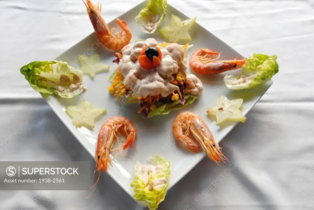 Salad by Nano Calvo Salad with lettuce shrimps pineapple and pink sauce