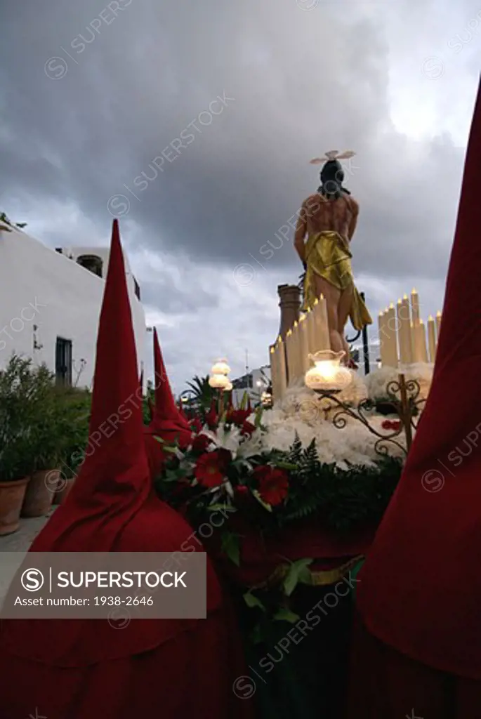 Good Friday Easter Parade in Santa Eulalia del Rio Ibiza They start from Puig de Missa church that gives name to an architectural ensemble situated situated on a hilltop and walk down through this coastal Mediterranean village