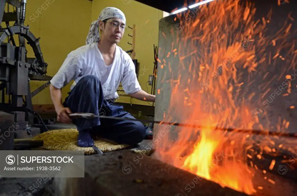 Japan, Saitama, Japanese Sword Blacksmith working at his workshop
