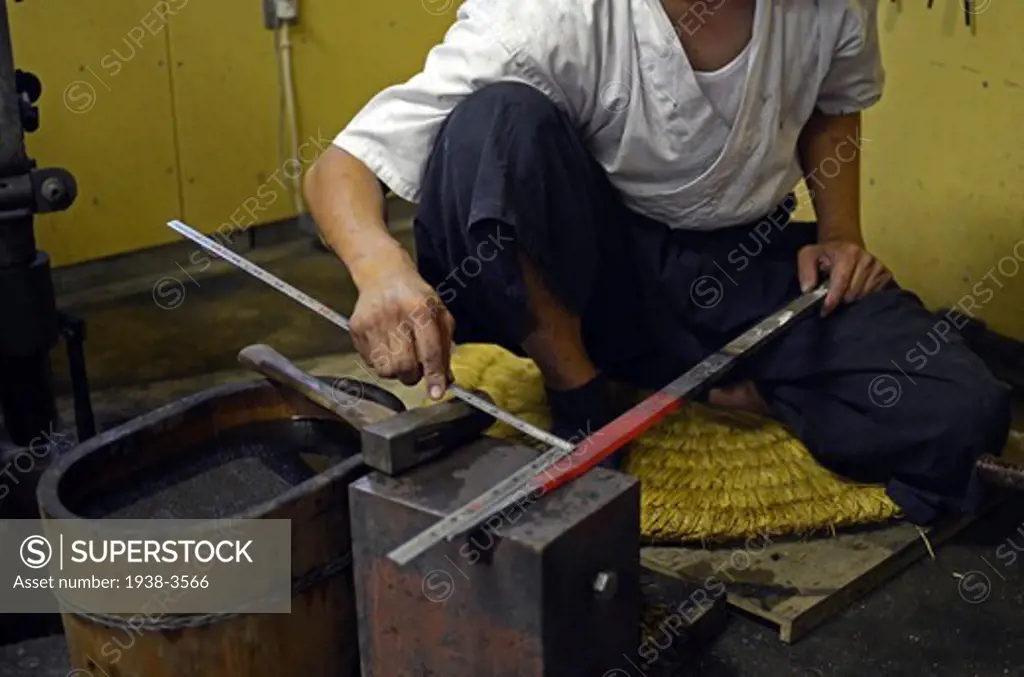 Japan, Saitama, Japanese Sword Blacksmith working at his workshop