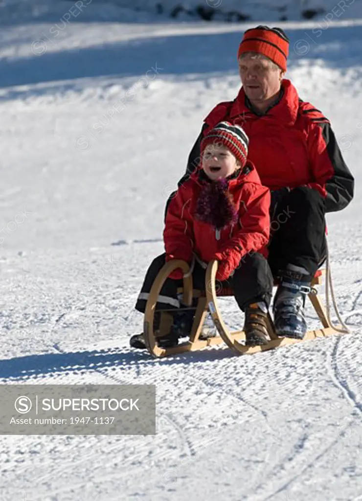 Family skiing and sledging in Kaiserau  Steiermark  Austria