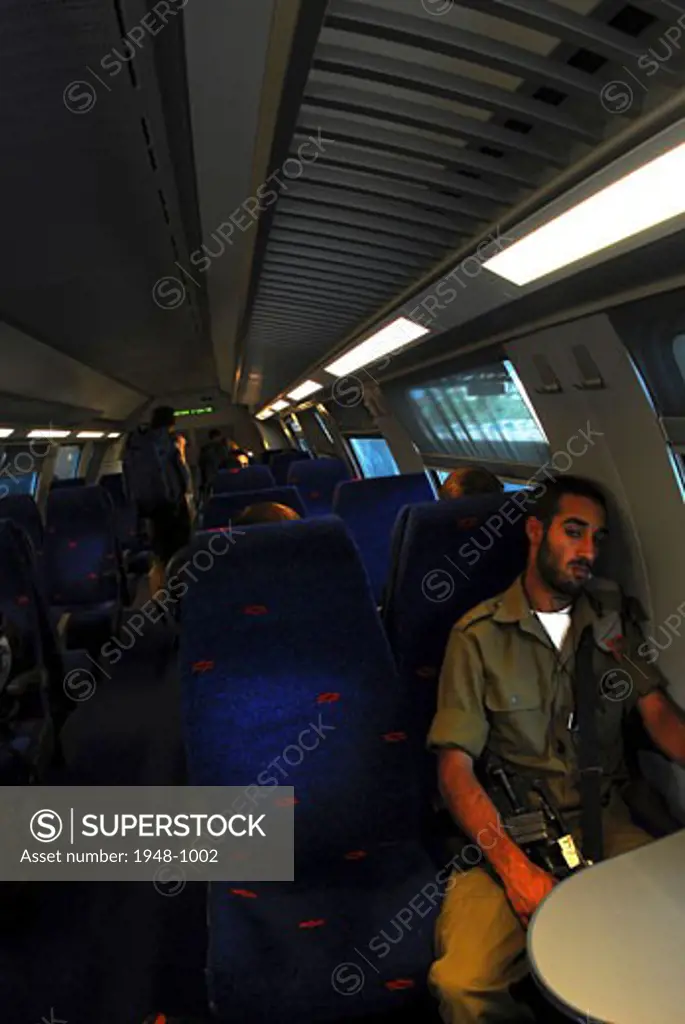 Man in military service  on a train  Tel Aviv  Israel