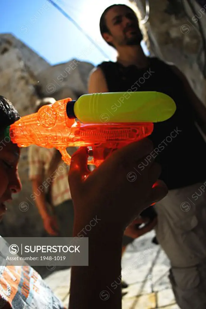 Kid playing with gun  Jerusalem