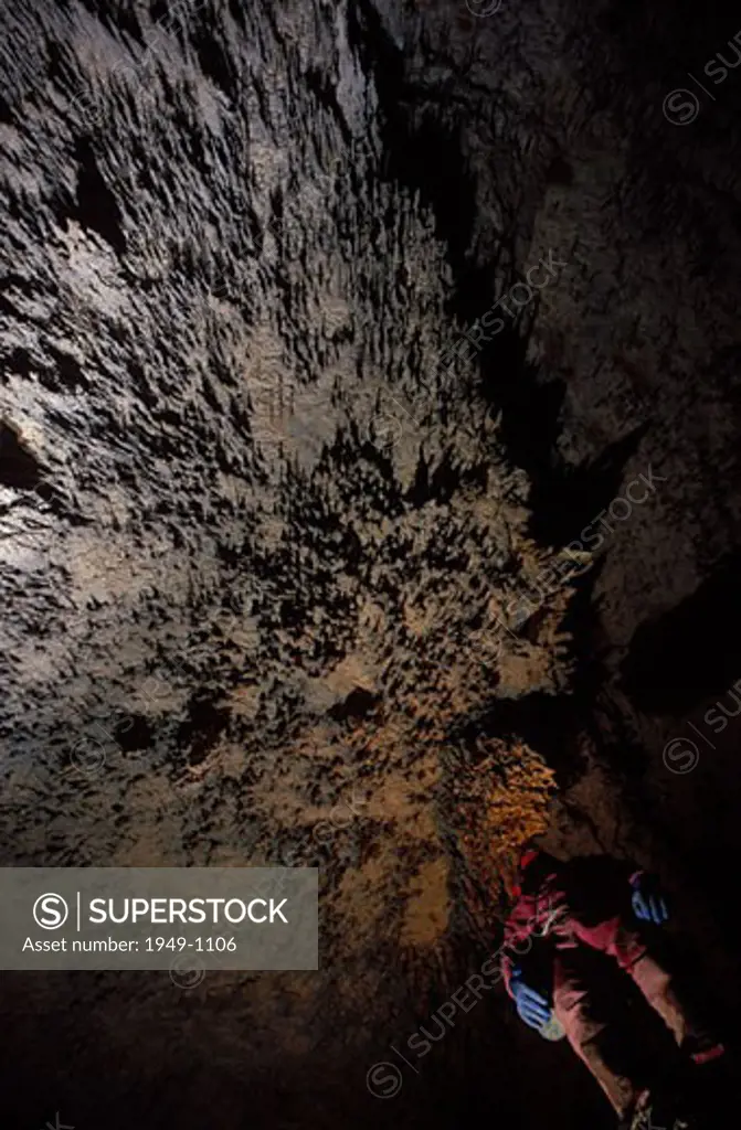 Speleologist in Cueva del Molino de Aso next to Parque Nacional de Ordesa y Monte Perdido or Ordesa and Monte Perdido National Park Aragon Spain