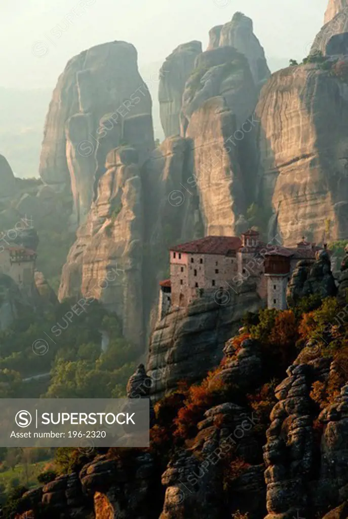 Greece, Thessalia, Meteora, Dramatic landscape with monastery on top of rock