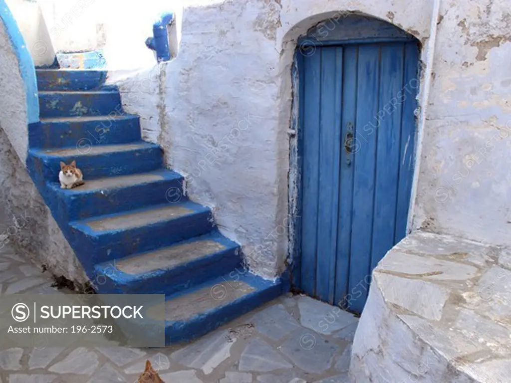 Greece, Cyclades, Tinos island, Blue door and steps