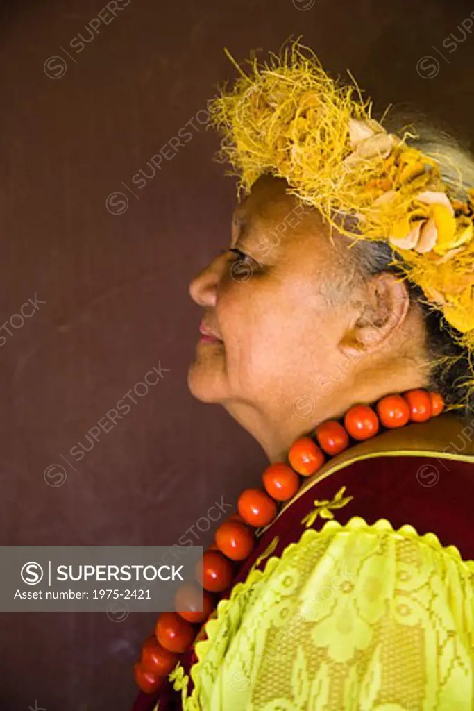Side profile of a woman in traditional Polynesian dress
