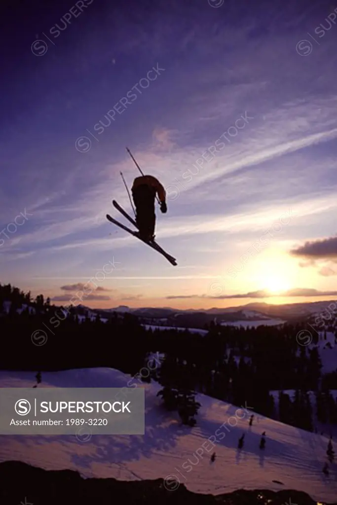 A man jumping on skis at Squaw Valley in California