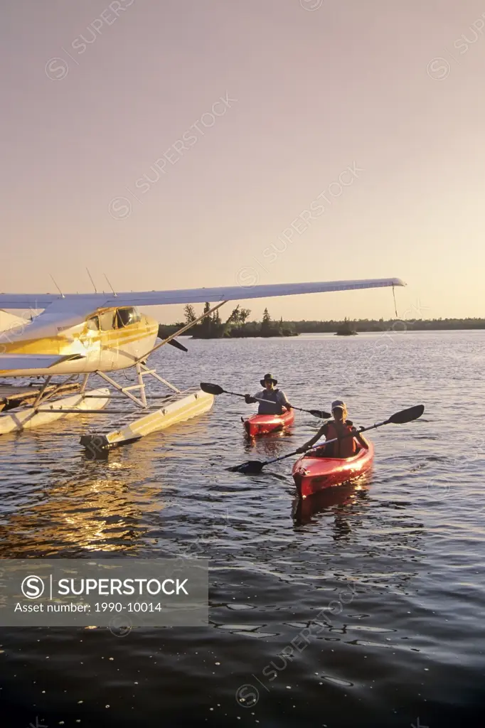 Couple kayaking, Otter Falls, Whiteshell Provincial Park, Manitoba, Canada.