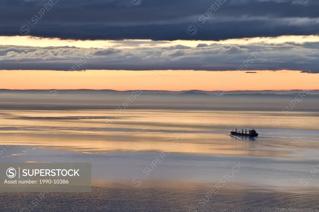 Cargo ship descending the St. Lawrence River near Les Eboulements, Charlevoix, Quebec, Canada