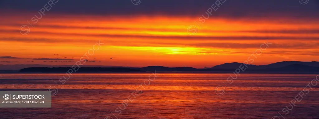 Dawn skies over Haro Strait and the San Juan Islands, Victoria (Cordova Bay), BC, Canada