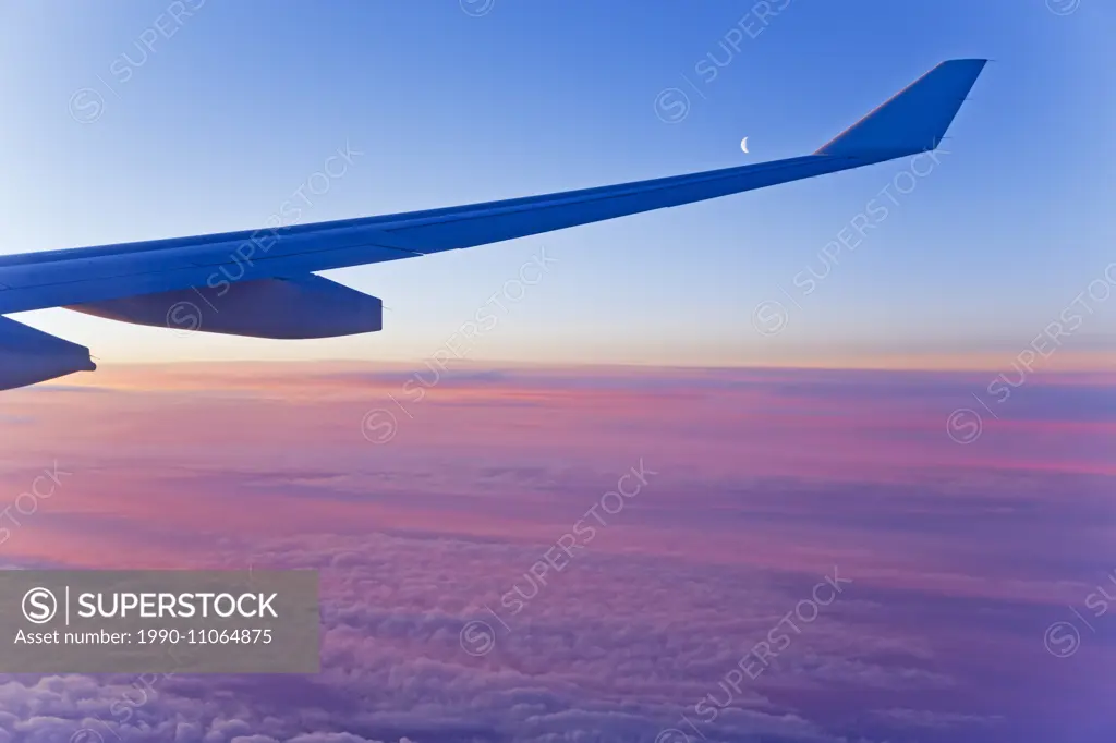 Aerial, clouds, flying, new moon, sunrise, airplane wing,