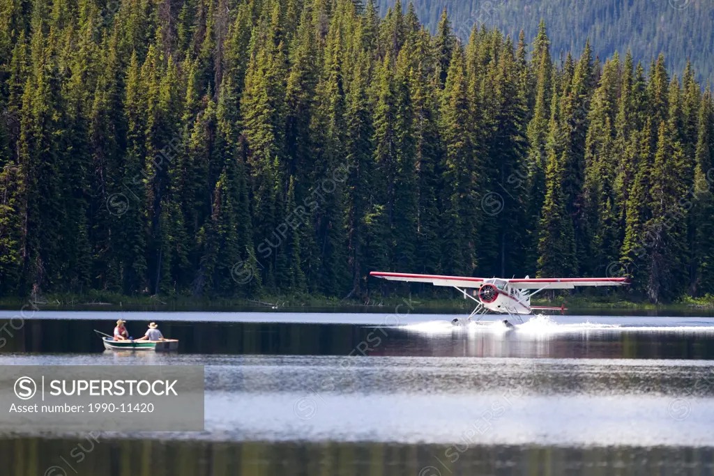 ´Beaver´ floatplane landing on Spruce Lake, ,flying in fisherman. Southern Chilcotin Mountains, British Columbia, Canada