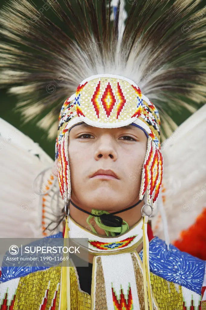 Blackfoot blood male dancer in traditional mens fancy dance outfit, Fort McLeod, Lethbridge, Alberta, Canada.