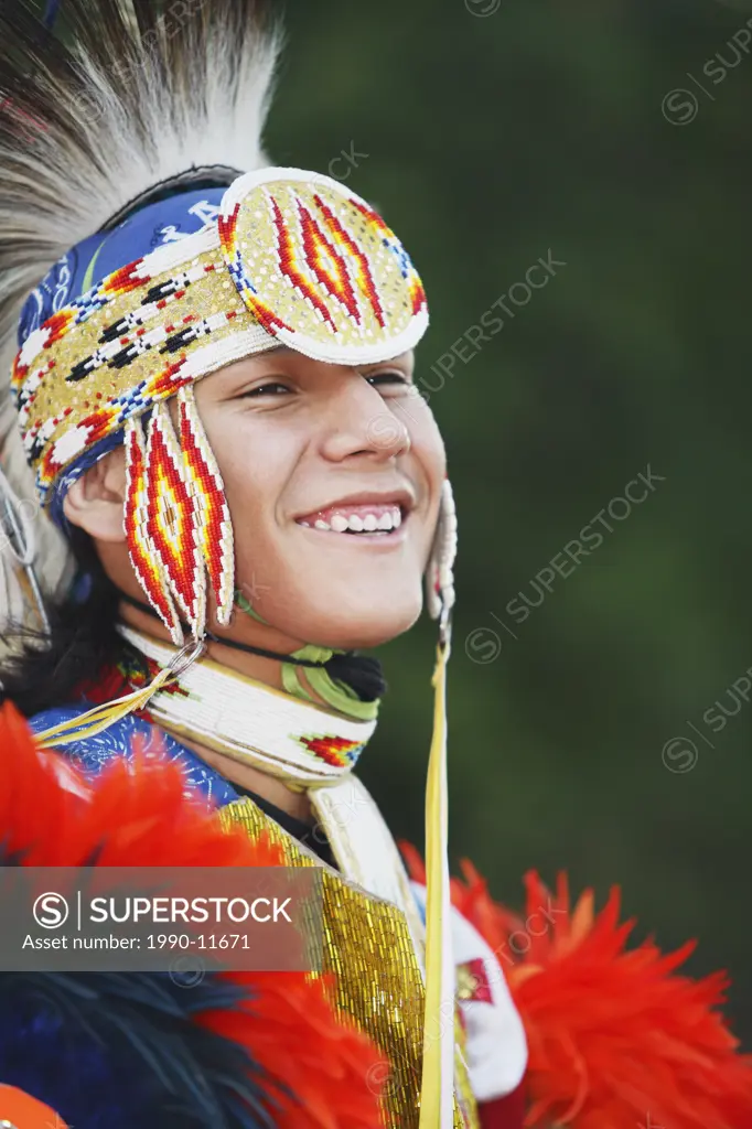 Blackfoot blood male dancer in traditional mens fancy dance outfit, Fort McLeod, Lethbridge, Alberta, Canada.