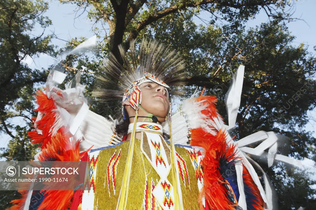 Blackfoot Blood First Nations  male dancer in traditional mens fancy dance outfit, Fort McLeod, Lethbridge, Alberta, Canada.