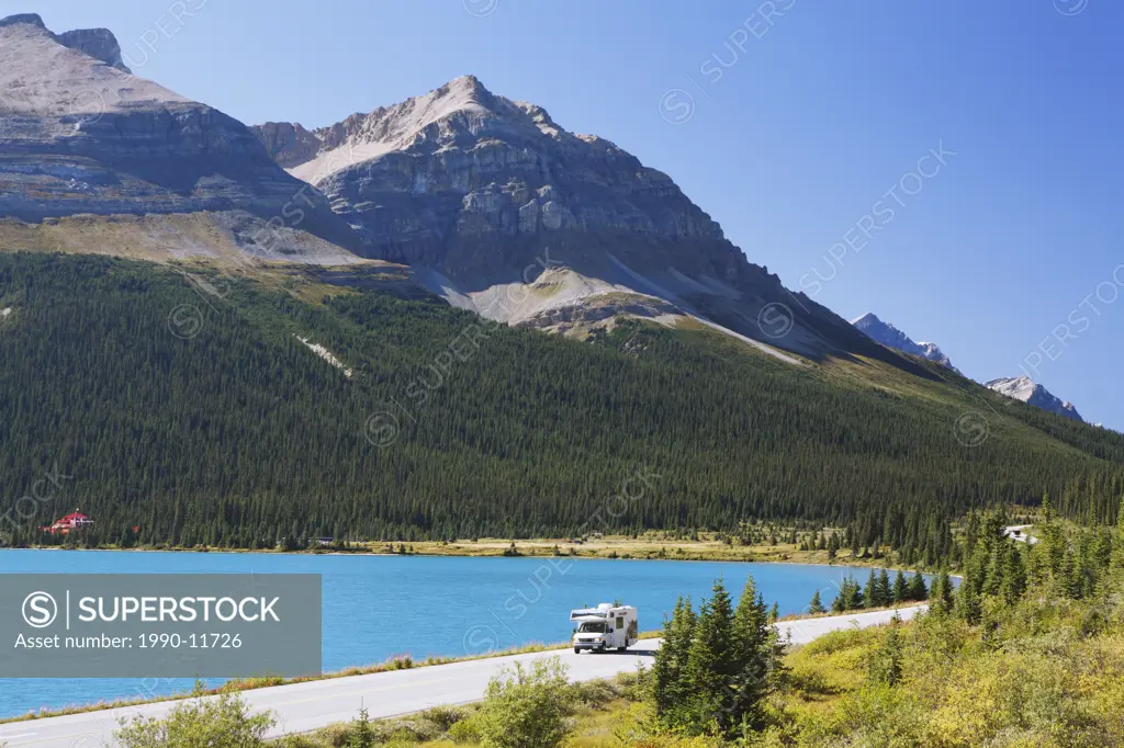 An rv touring past Bow Lake and Num_ti_jah Lodge along the world famous Icefields Parkway between Banff and Jasper National Parks in the Canadian Rock...