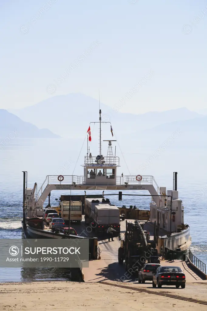 A BC Ferry loads up in Shelter Bay on the Upper Arrow Lakes as it prepares to transport tourists and other vehicles to Galena Bay in the Kootenays, Br...