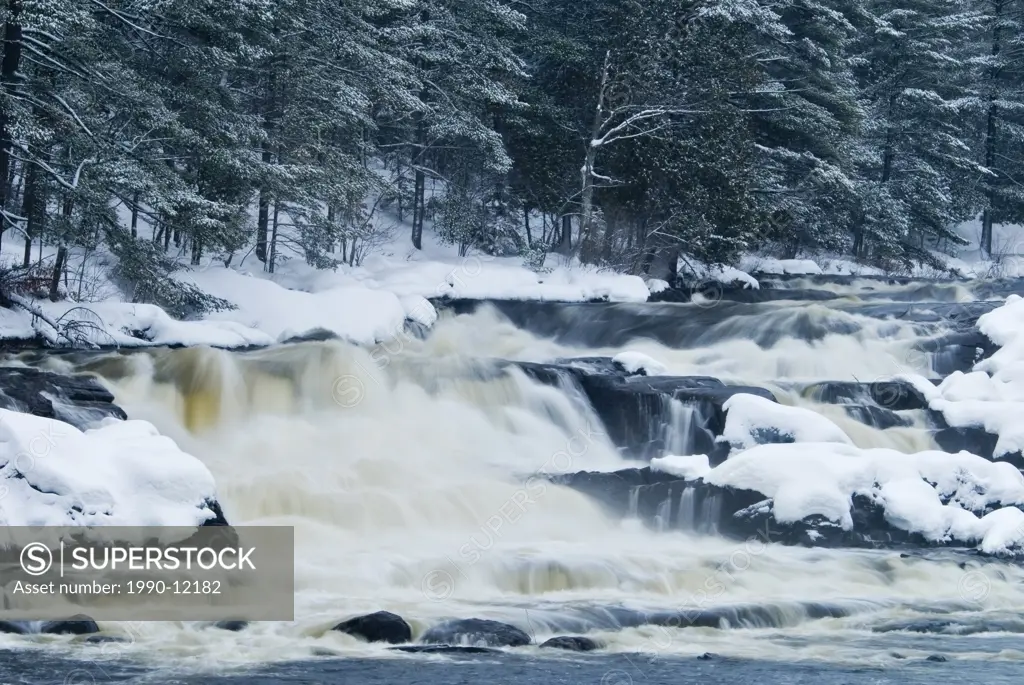 Winter at Wilson´s Falls on the Muskoka River along the Trans_Canada Trail in the Muskoka region near Bracebridge, Ontario, Canada.