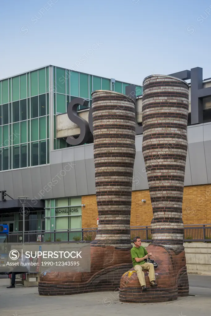 Brick sculpture of a pair of legs, called 'Immense Mode' , Southgate LRT Station, Edmonton, Alberta, Canada