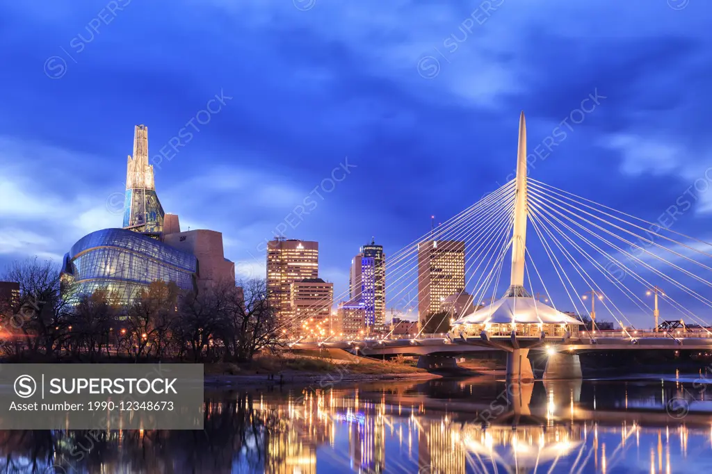 Winnipeg skyline at night with Canadian Museum for Human Rights and Esplanade Riel Bridge, Winnipeg, Manitoba, Canada