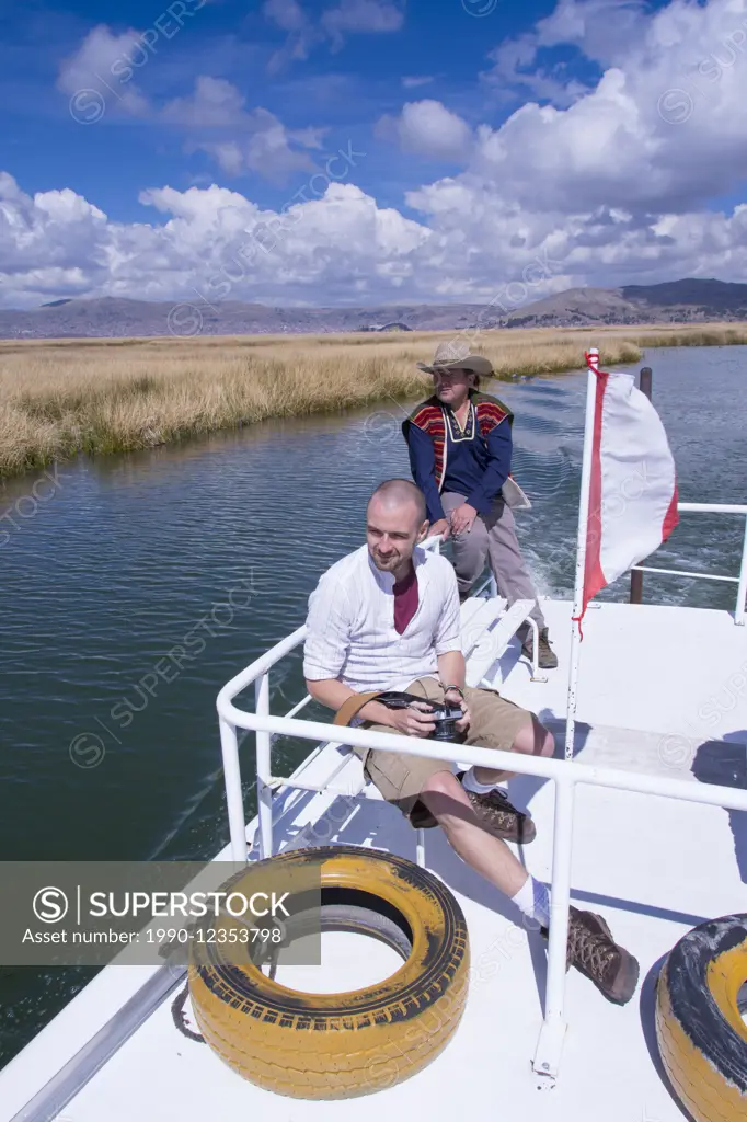Visitors aboard tour boat, Lake Titicaca, Peru