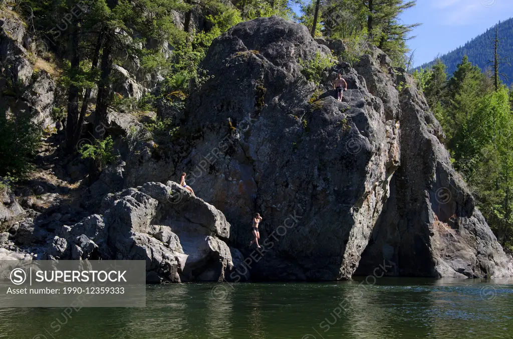 Jumping off Bromley Rock into the Similkameen River, Bromley Rock Provincial Park, near Princeton, British Columbia, Canada