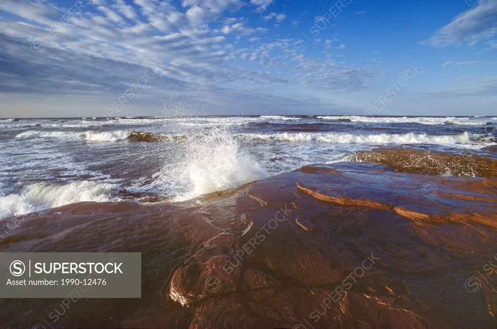 Waves breaking on sandstone rocks, Cavendish Beach, Prince Edward Island National Park, Prince Edward Island, Canada