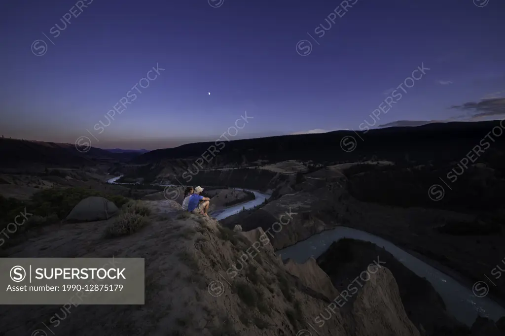 Canada, British Columbia, Chilcotin, BC grasslands, Farwell Canyon area, campers overlook Chilcotin River, sunset,