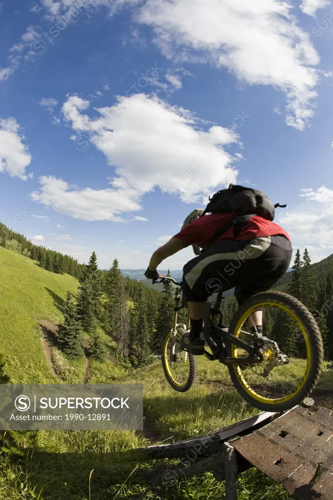 A young man in a rush to get down Moose Mountain, Kananaskis, Calgary, Alberta, Canada.