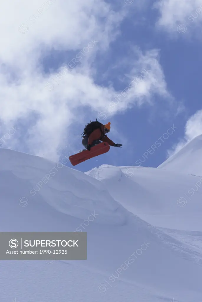 A snowboarder getting air in Rogers Pass, British Columbia, Canada.