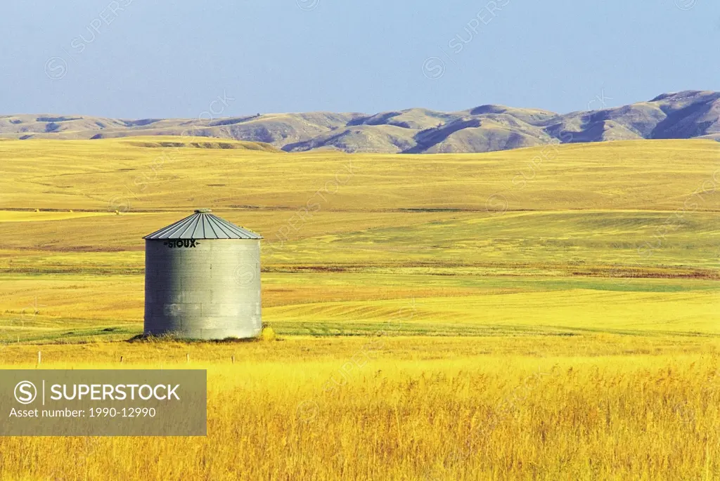 grain bin on hill, Big Muddy Badlands, Saskatchewan, Canada