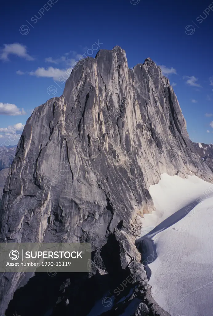 Climbers below Snowpatch Spire Bugaboo Glacier Provincial Park Purcell Mountains, British Columbia, Canada.