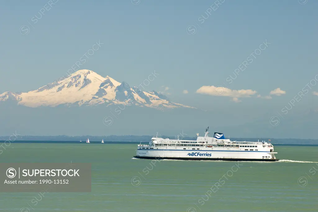 A BC Ferry crosses the Strait of Georgia with Mount Baker in background on it´s way to Vancouver, British Columbia, Canada.