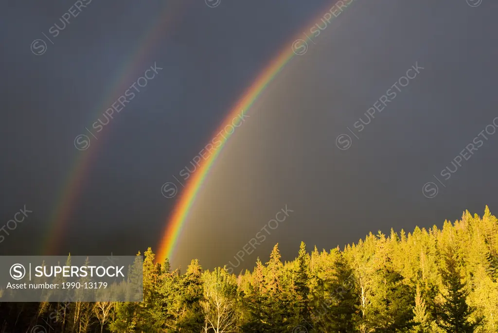 A double rainbow during a storm in Banff National Parknear Banff Alberta, Canada.
