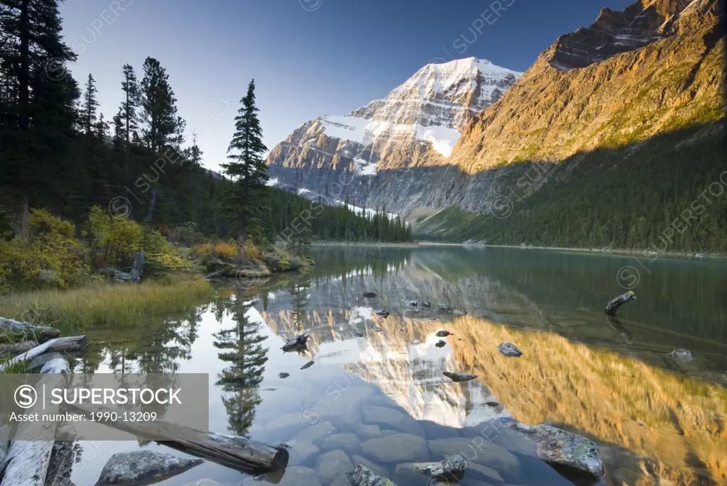 Mount Edith Cavell reflected in Cavell Lake in Jasper National Park, Alberta, Canada.