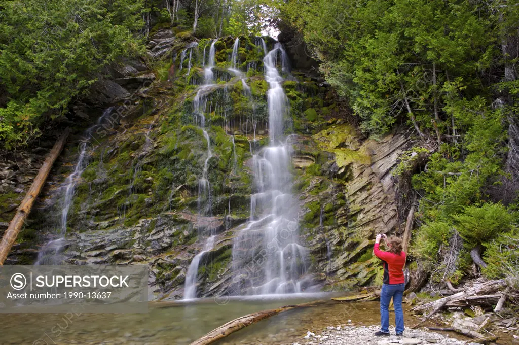 Tourist at La Chute, Waterfall in Forillion National Park, North Area, Land´s End, Gaspesie, Gaspesie Peninsula, Highway 132, Quebec, Canada.