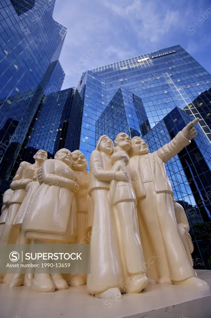 The Illuminated Crowd by artist Raymond Mason at the entrance to the BNP Tower _ Laurentian Bank Tower in downtown Montreal, Quebec, Canada.