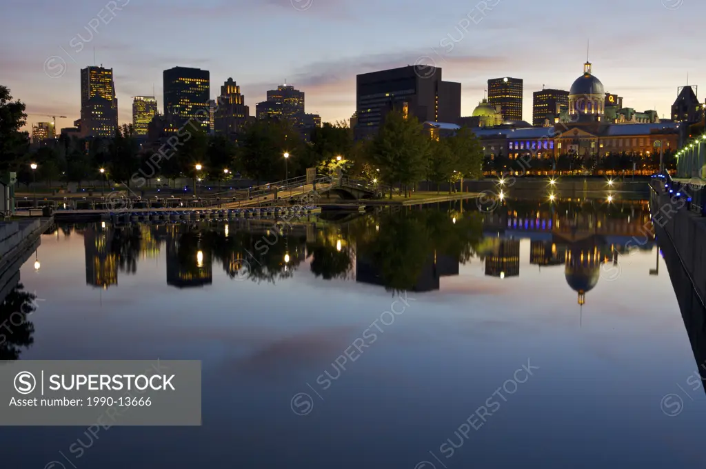 Downtown Montreal seen from the Bonsecours Basin in Old Montreal and Old Port at night, Montreal, Quebec, Canada.