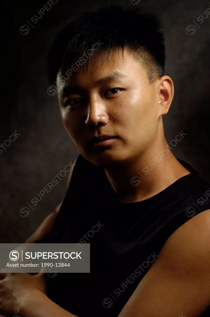 Young asian man around 20 years old Korean ethnicity Artistic expressive vertical low_key portrait