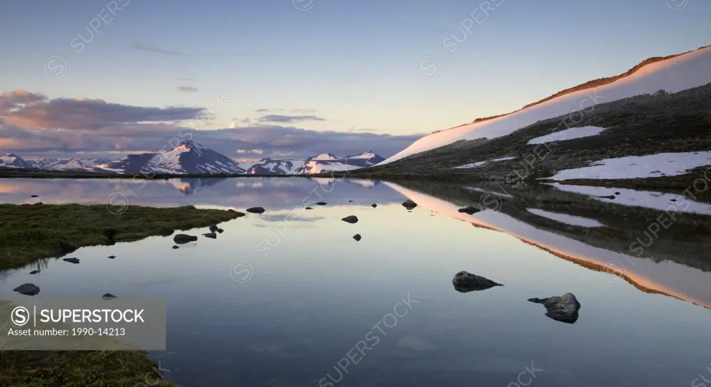 Sunrise over an alpine tarn, Coast Mountains, British Columbia, Canada