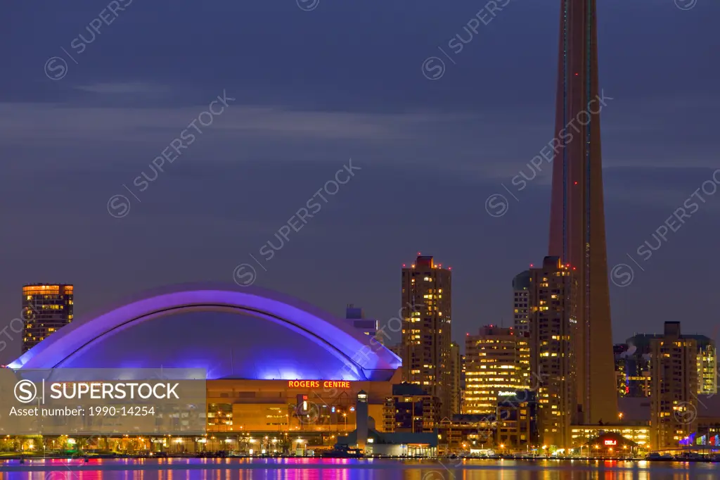Skyline of Toronto with CN Tower and Rogers Centre at dusk, Toronto, Ontario, Canada